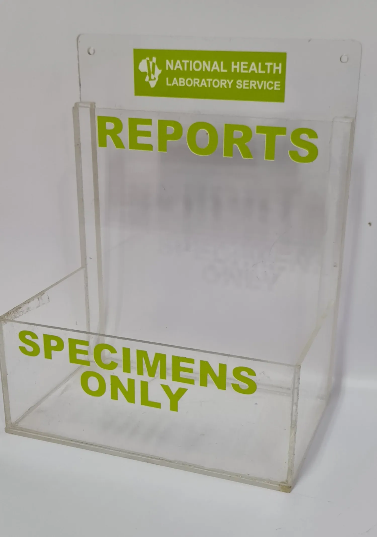 Clear acrylic wall holder printed with green lettering reading Reports and Specimens Only.